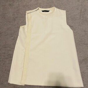 Sleeveless off-white silk blouse